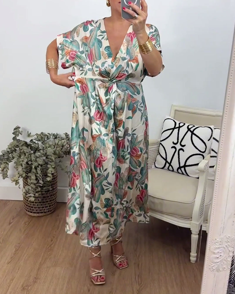 Elegantes Kleid mit V-Ausschnitt und Twist-Muster im Botanischen Druck