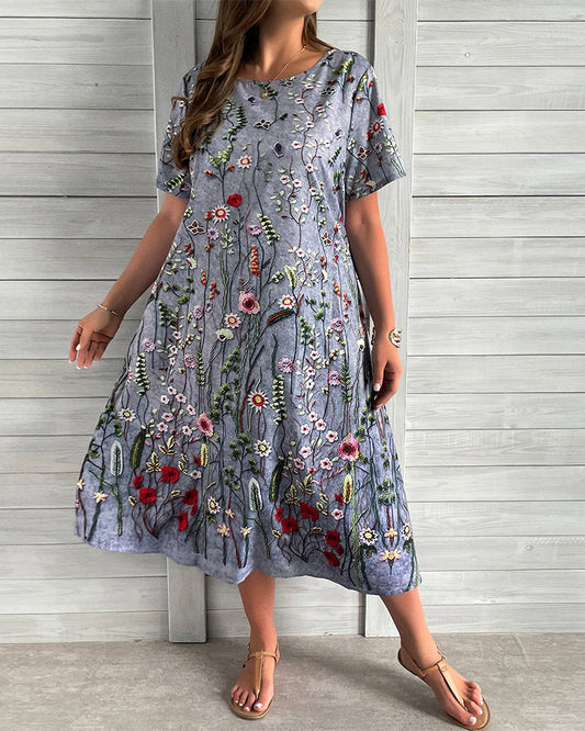 Kleid mit Rundhalsausschnitt und Tasche und Blumenmuster